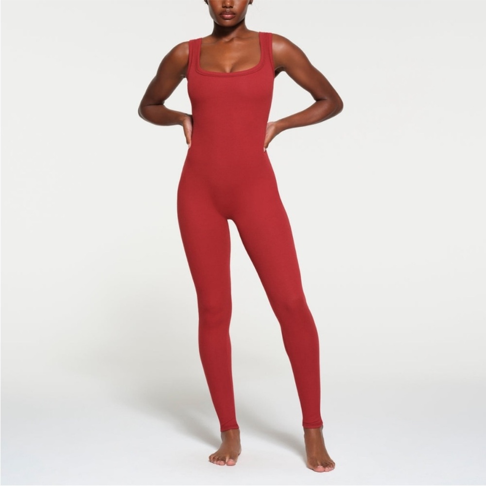 SKIMS Cotton Jersey Ribbed Onesie in Brick